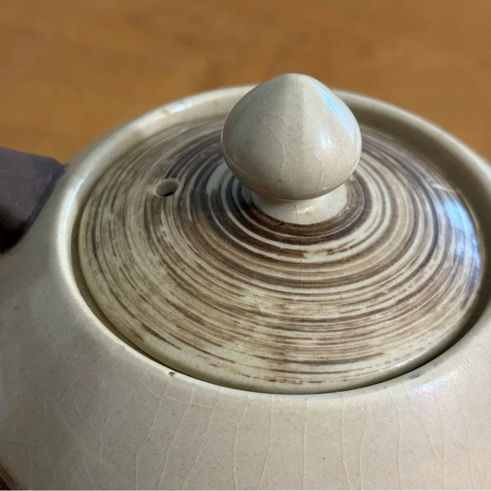 Antique brown and white ceramic teapot‎